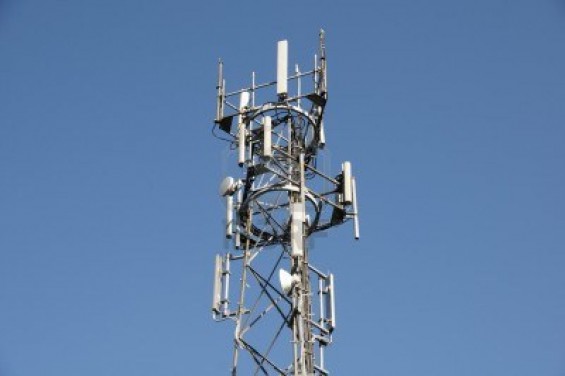 4951557 a phone mast against a clear blue sky