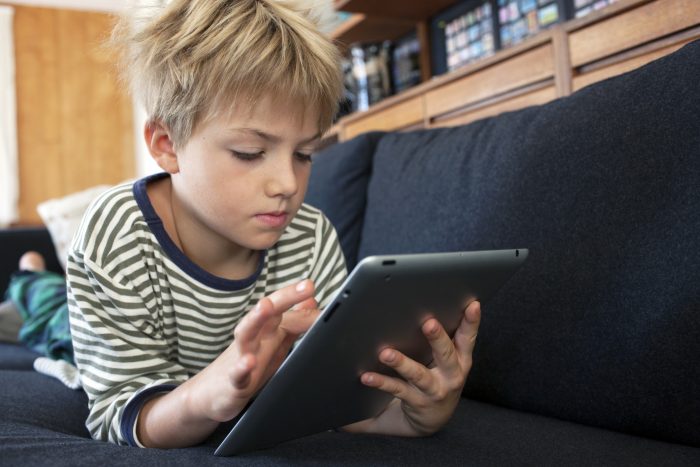 child playing on tablet 1