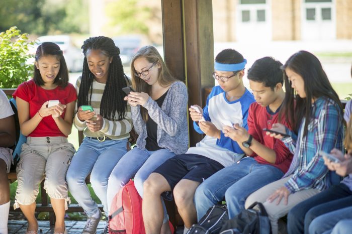 Students Texting on Their Cell Phones