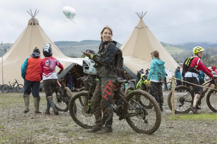 Juliet Elliott uses her phone to check her run after the race over the EE 4G air mast