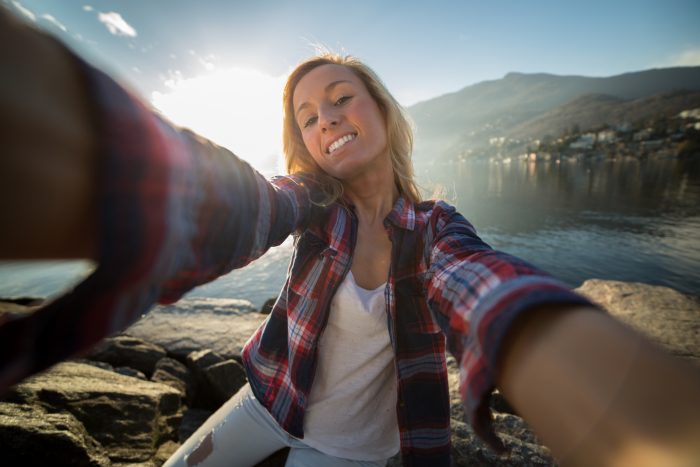 Attractive young woman taking selfie