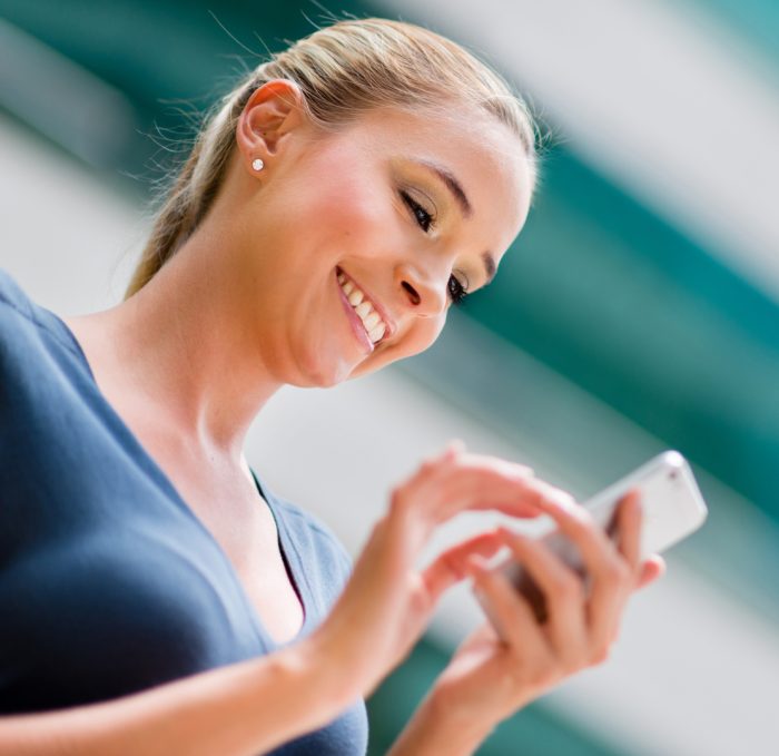 Business woman using a smart phone